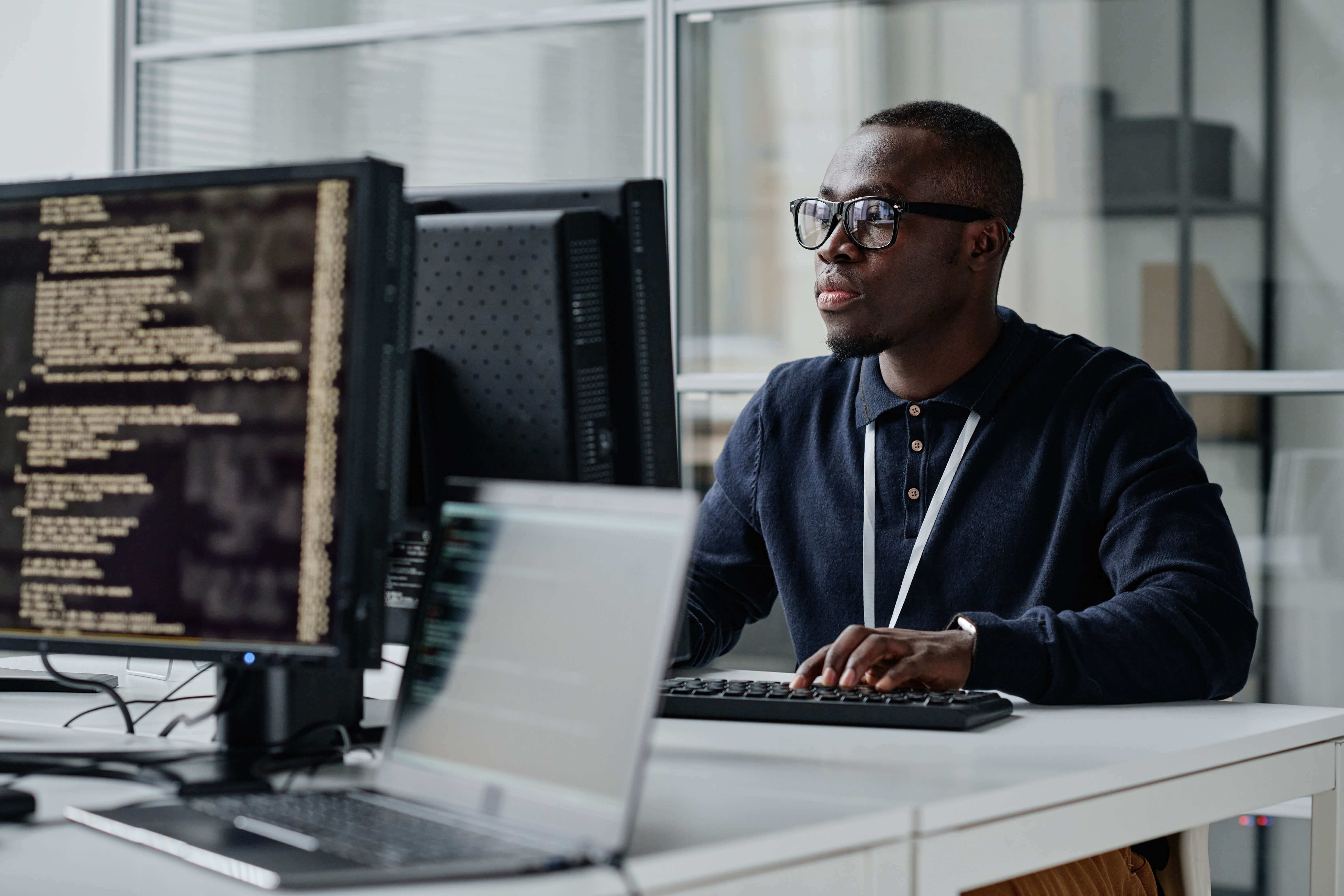 employee in smart clothing typing on a computer